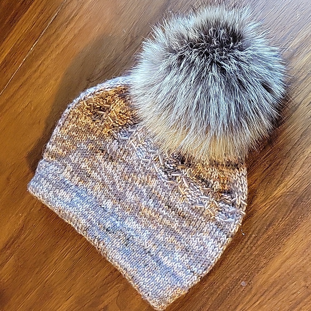 Beautiful handknit wool hat with real fur pom.